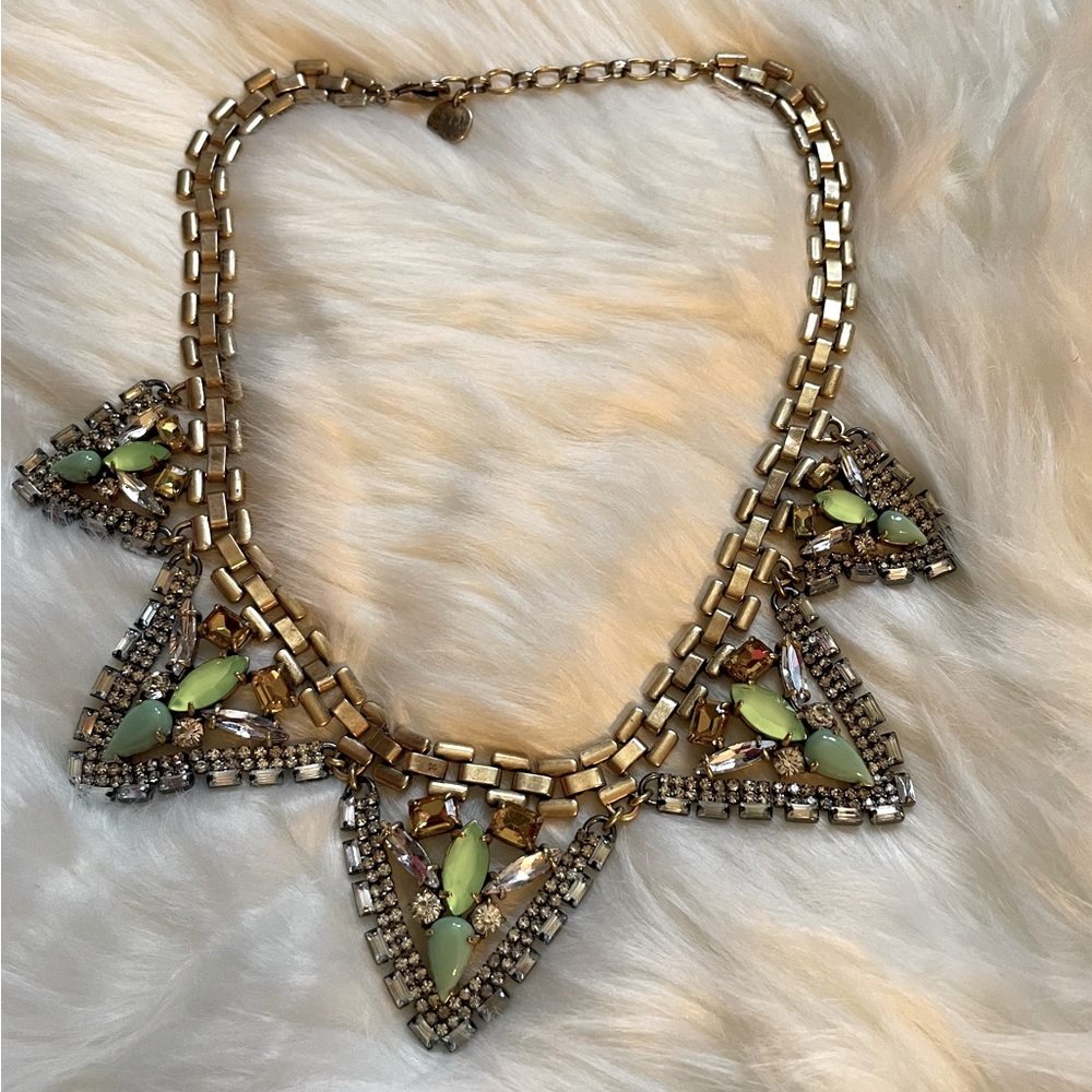 Stunning gold necklace with green crystals